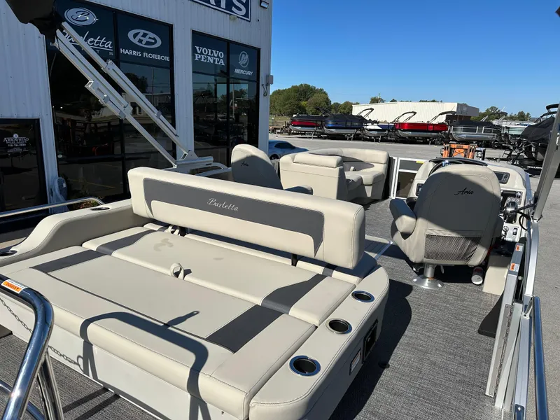Slide: The Image of 2024 Barletta A20UC pontoon boat with luxurious seating and modern design. - 12