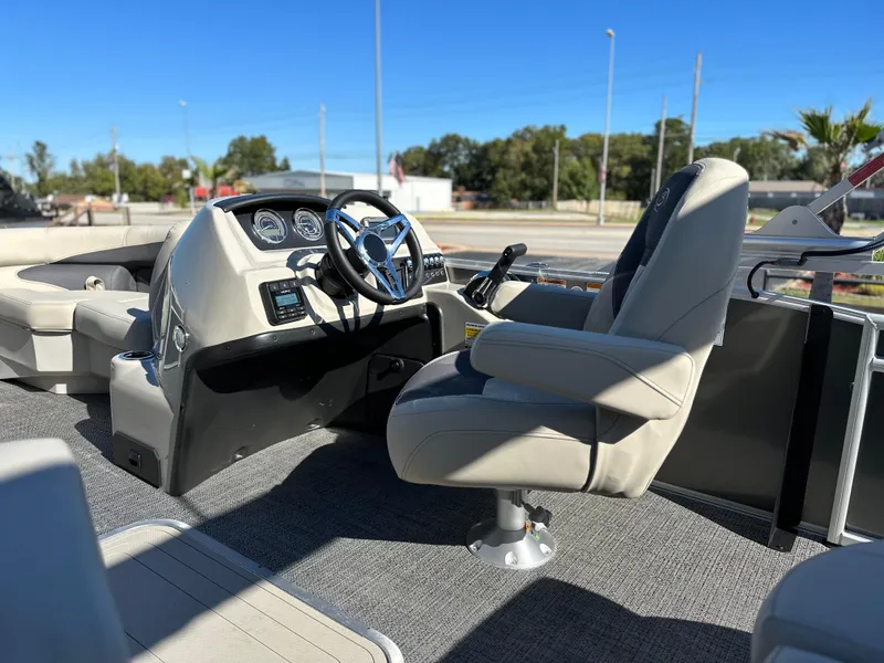 Slide: The Image of 2024 Barletta A20UC boat interior with steering wheel and captain's chair. - 14