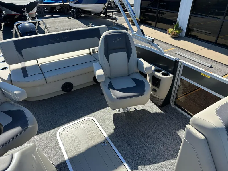Slide: The Image of 2024 Barletta A20UC boat interior with gray seating and carpeted flooring. - 23