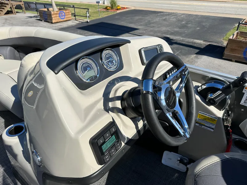 Slide: The Image of 2024 Barletta A20UC boat dashboard with steering wheel and gauges. - 24
