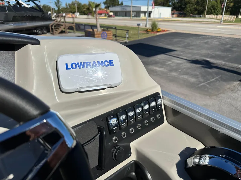 Slide: The Image of 2024 Barletta A20UC boat dashboard with Lowrance Hook display and control panel. - 25