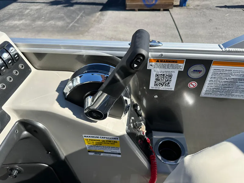 Slide: The Image of 2024 Barletta A20UC boat control panel with throttle and warning labels. - 26