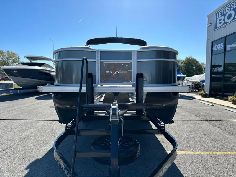 Slide: The Image of 2024 Barletta A20UC pontoon boat on trailer at dealership. - 8