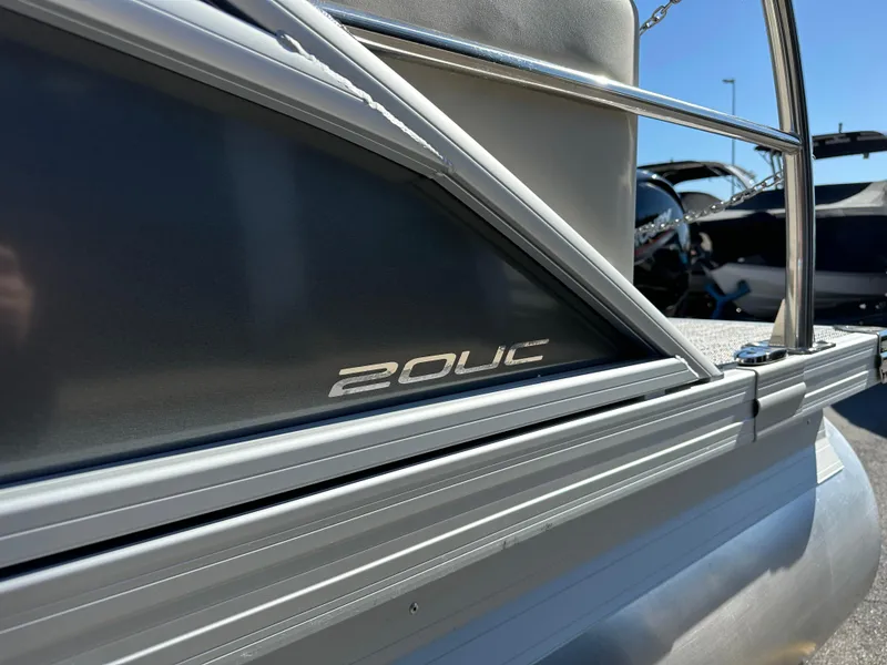 Slide: The Image of 2024 Barletta A20UC boat side view with model name detail. - 9