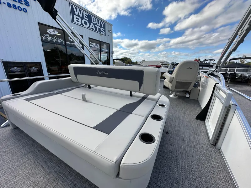 Slide: The Image of 2024 Barletta A22UC pontoon boat interior with seating and cup holders. - 11