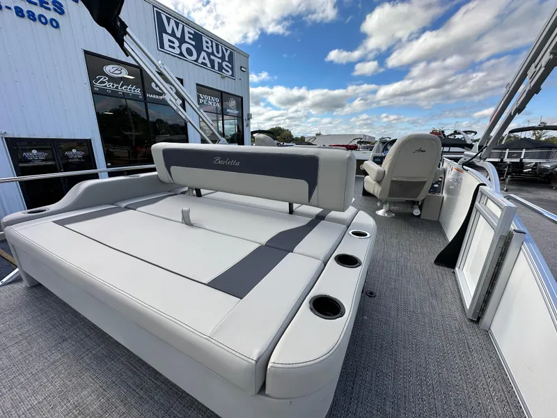 Slide: The Image of 2024 Barletta A22UC pontoon boat interior with seating and cup holders. - 12