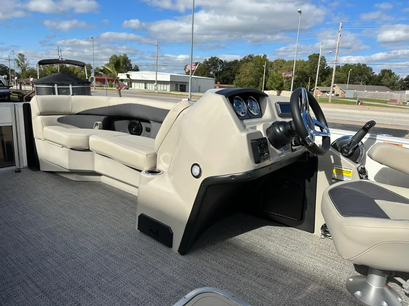 Slide: The Image of 2024 Barletta A22UC boat interior with modern dashboard and comfortable seating. - 19