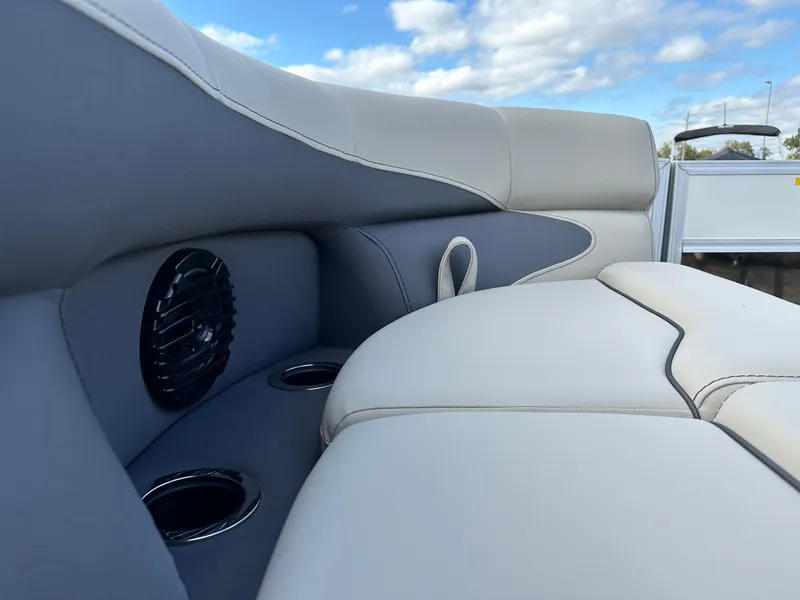 Slide: The Image of 2024 Barletta A22UC boat interior with cushioned seating and cup holders. - 21