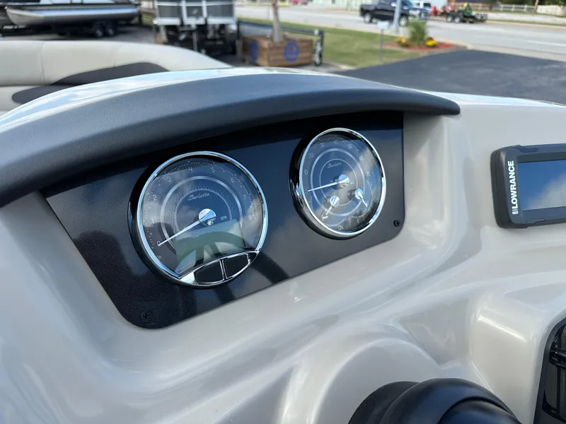Slide: The Image of 2024 Barletta A22UC dashboard with gauges and Lowrance display. - 23