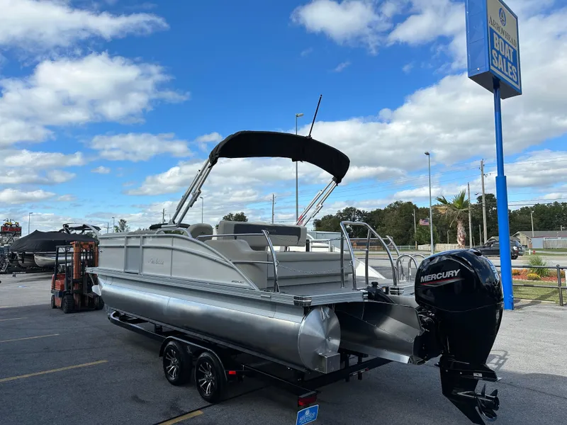 Slide: The Image of 2024 Barletta A22UC pontoon boat with Mercury engine at dealership. - 5