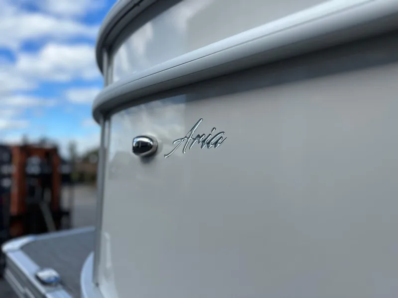 Slide: The Image of 2024 Barletta A22UC boat with "Aria" emblem, close-up view. - 8