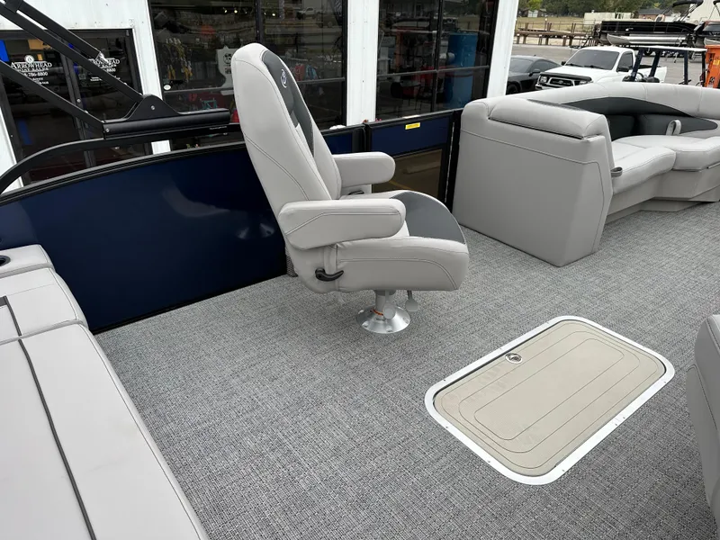 Slide: The Image of 2025 Barletta A22UC boat interior with gray seating and carpeted flooring. - 13