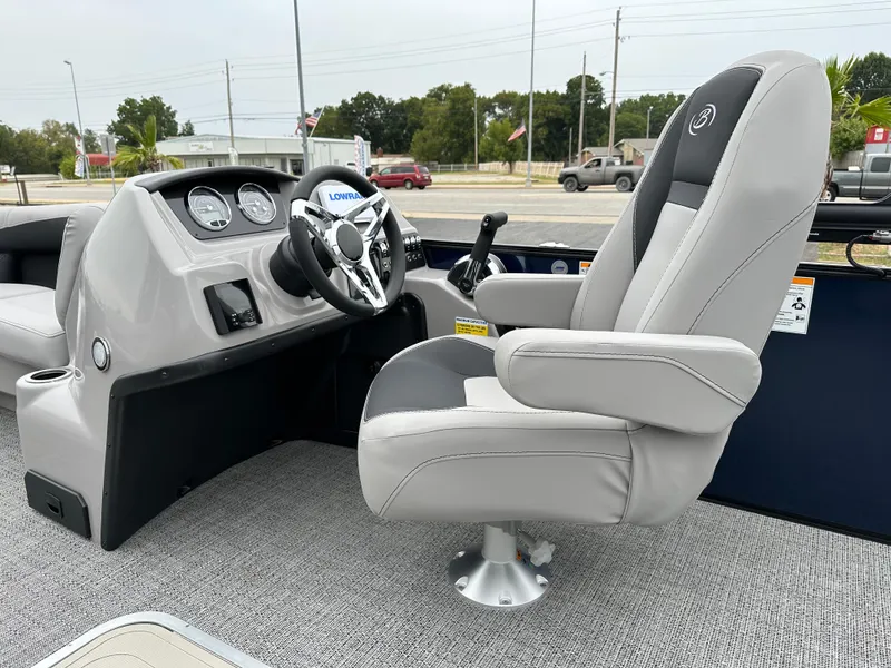 Slide: The Image of Barletta A22UC 2025 boat interior with steering console and captain's chair. - 14