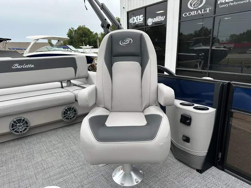 Slide: The Image of 2025 Barletta A22UC boat interior with plush seating and modern design. - 16