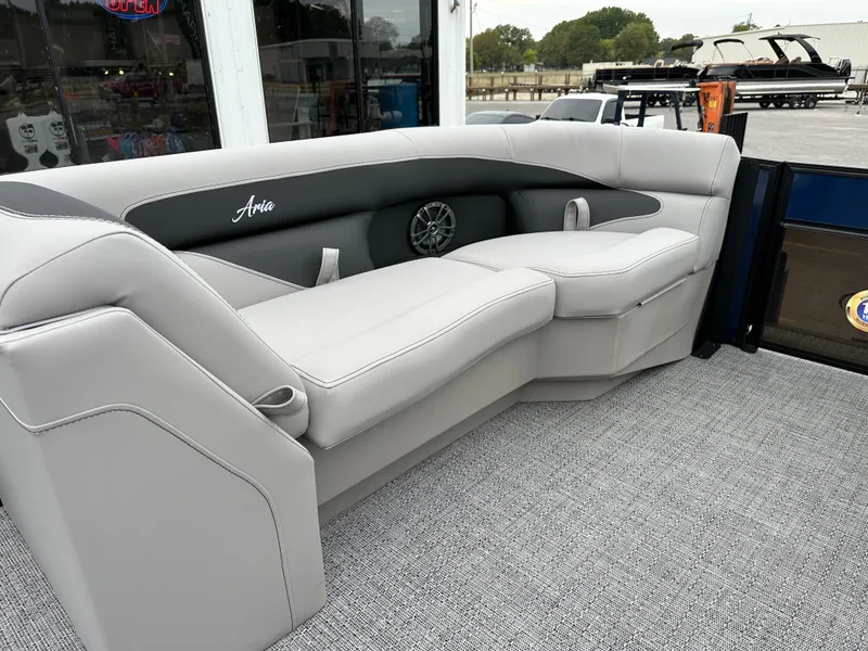 Slide: The Image of 2025 Barletta A22UC boat interior with gray seating and speaker. - 17