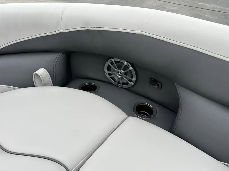 Slide: The Image of 2025 Barletta A22UC boat interior with speaker and cup holders. - 19