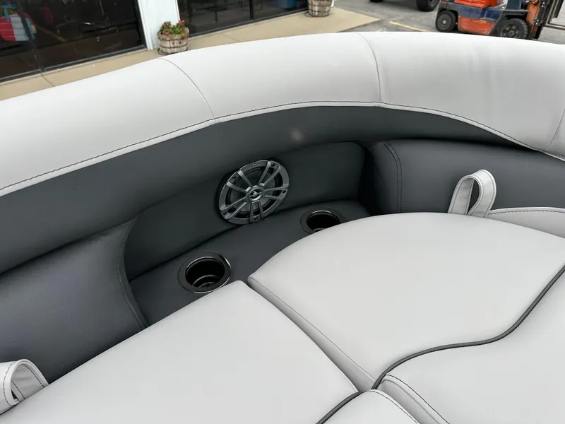 Slide: The Image of 2025 Barletta A22UC boat interior with speaker and cup holders. - 20