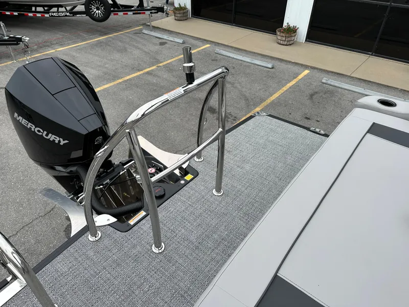 Slide: The Image of 2025 Barletta A22UC boat with Mercury engine, docked in parking lot. - 23