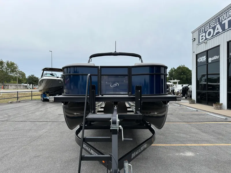 Slide: The Image of 2025 Barletta A22UC pontoon boat on trailer at dealership. - 3