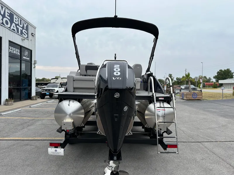 Slide: The Image of 2025 Barletta A22UC pontoon boat with 200 HP engine at dealership. - 7