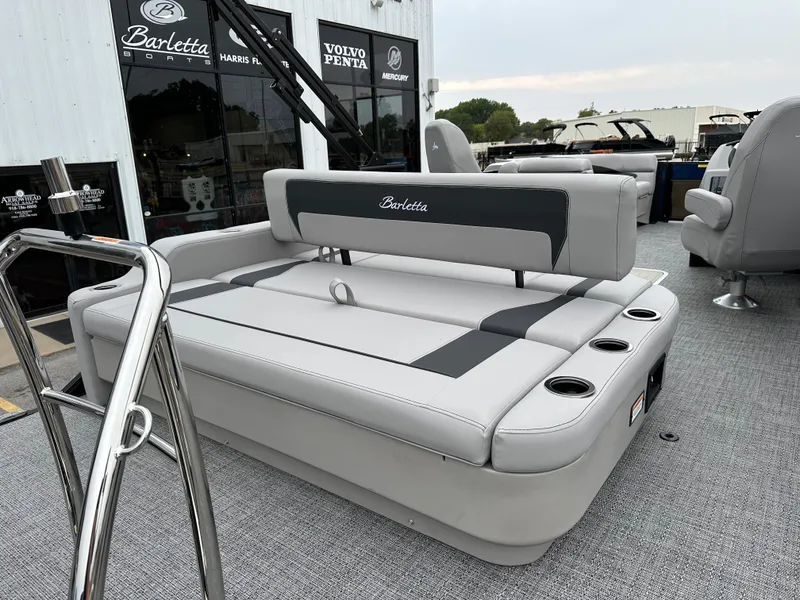 Slide: The Image of 2025 Barletta A22UC boat interior with gray seating and cup holders. - 9