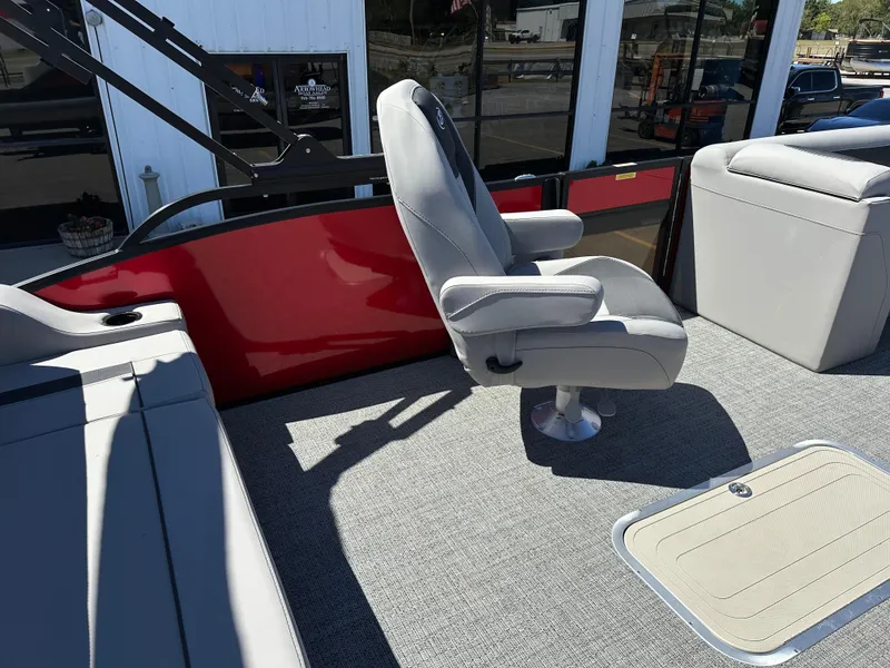 Slide: The Image of 2025 Barletta A24UC boat interior with gray seating and red panel. - 12