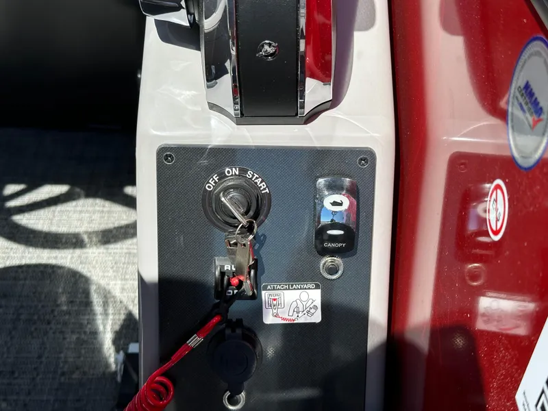 Slide: The Image of Close-up of 2025 Barletta A24UC boat ignition and control panel. - 16