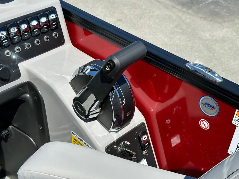 Slide: The Image of Close-up of 2025 Barletta A24UC boat controls and dashboard. - 17