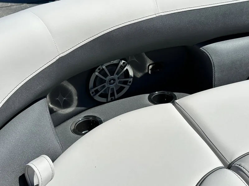 Slide: The Image of 2025 Barletta A24UC boat interior with speaker and cup holders. - 22