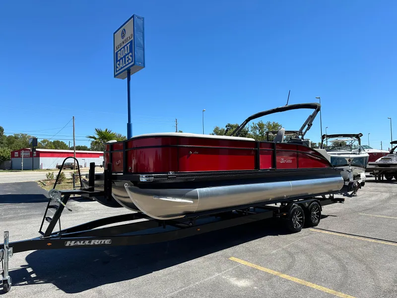 Slide: The Image of 2025 Barletta A24UC pontoon boat on trailer at Arrowhead Boat Sales. - 4