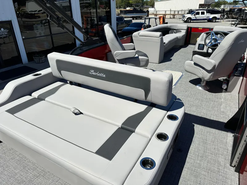 Slide: The Image of 2025 Barletta A24UC pontoon boat interior with luxurious seating and modern design. - 9