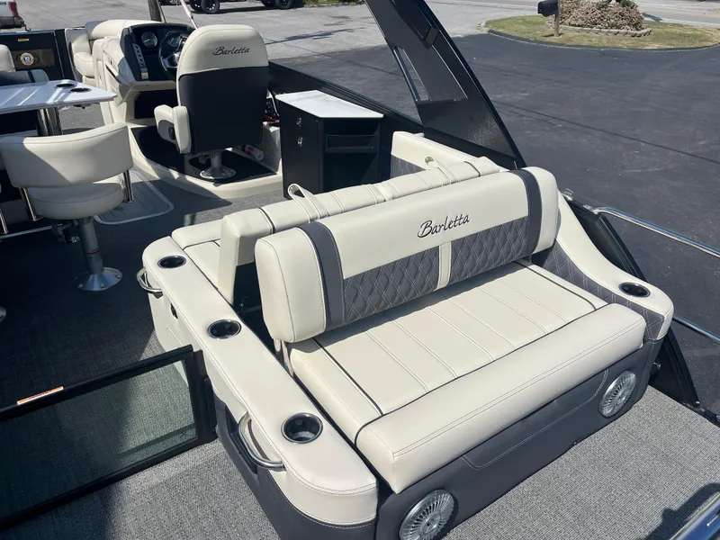 Slide: The Image of 2025 Barletta L25UEA pontoon boat interior with luxurious seating and modern design. - 14