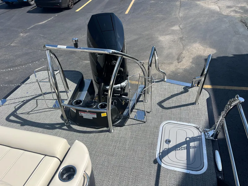 Slide: The Image of 2025 Barletta L25UEA boat deck with motor and seating area. - 16