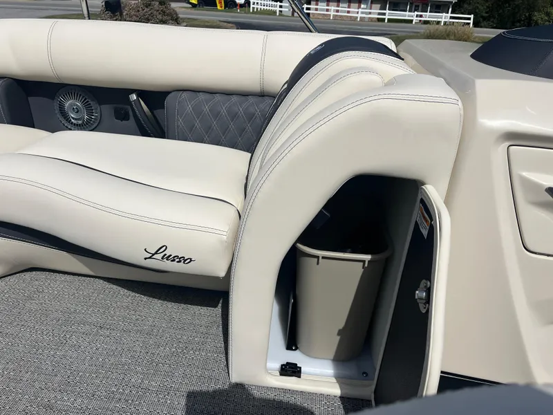 Slide: The Image of 2025 Barletta L25UEA boat interior with storage compartment and luxurious seating. - 35