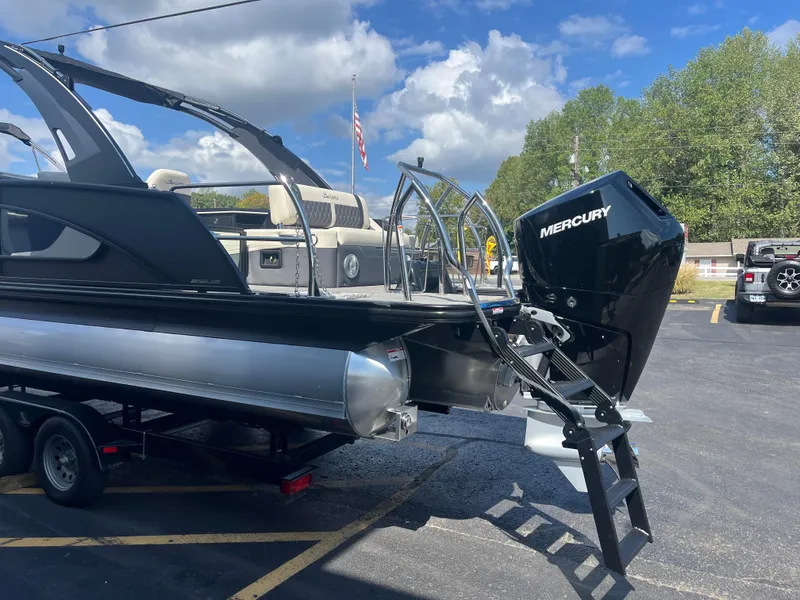 Slide: The Image of 2025 Barletta L25UEA pontoon boat with Mercury engine on trailer. - 6