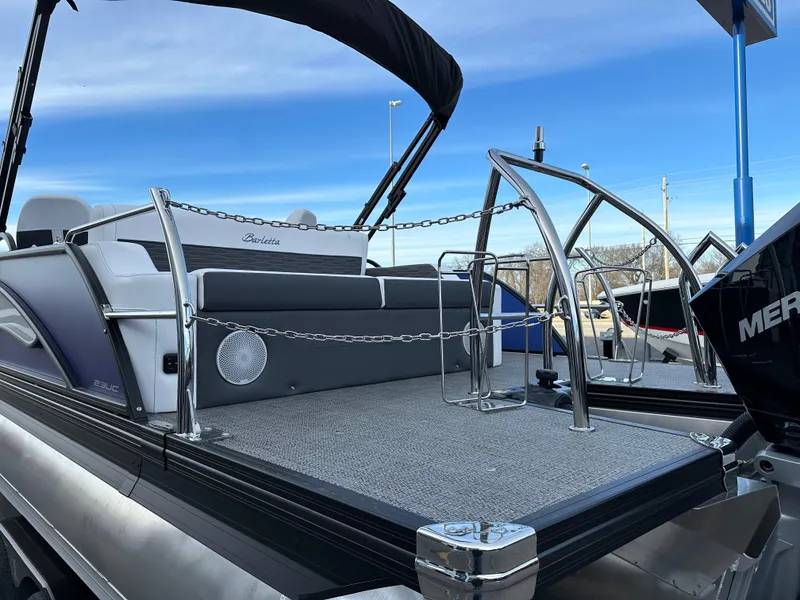 Slide: The Image of 2024 Barletta X23UC pontoon boat with sleek design and modern features. - 11
