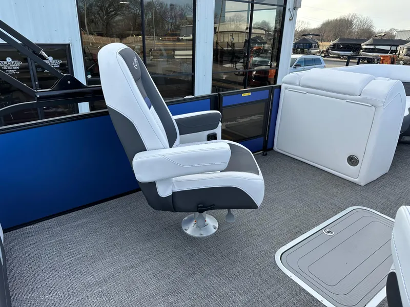 Slide: The Image of 2024 Barletta X23UC boat interior with plush seating and modern design. - 15