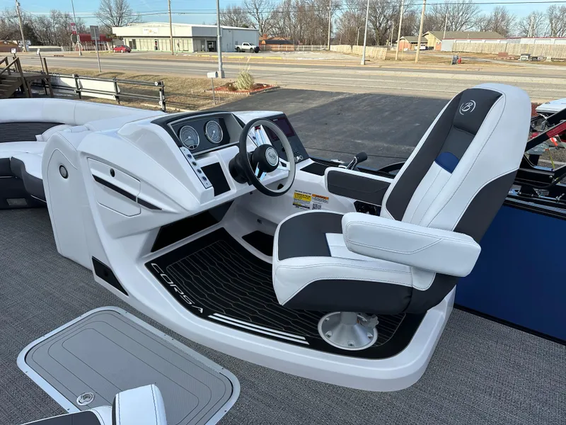 Slide: The Image of 2024 Barletta X23UC boat cockpit with modern steering and comfortable seating. - 16