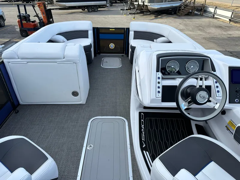 Slide: The Image of 2024 Barletta X23UC boat interior with modern dashboard and seating. - 18