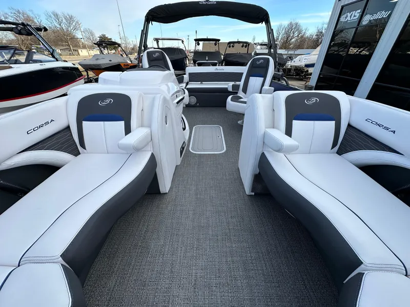 Slide: The Image of 2024 Barletta X23UC pontoon boat interior with luxurious seating and modern design. - 19