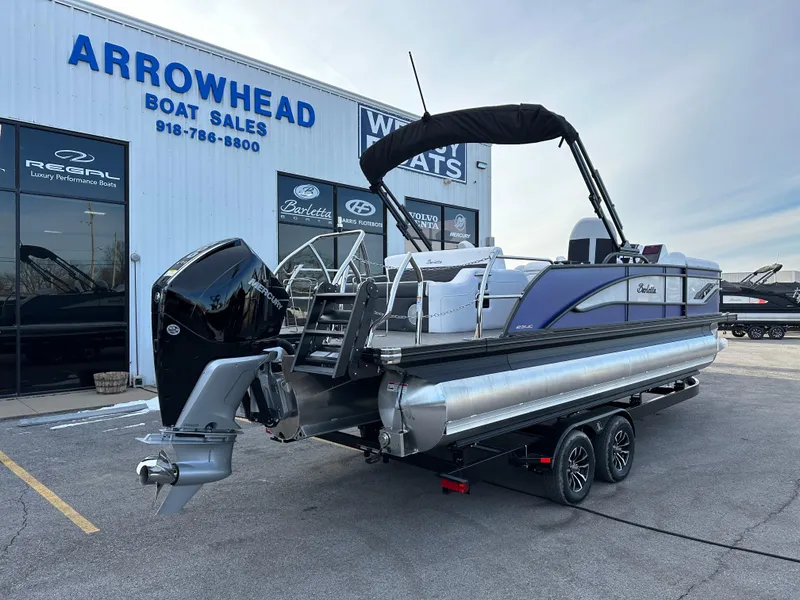 Slide: The Image of 2024 Barletta X23UC pontoon boat at Arrowhead Boat Sales dealership. - 3