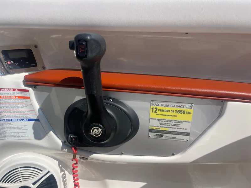 Slide: The Image of Control panel of 2010 Chaparral 226 boat with capacity warning label. - 16