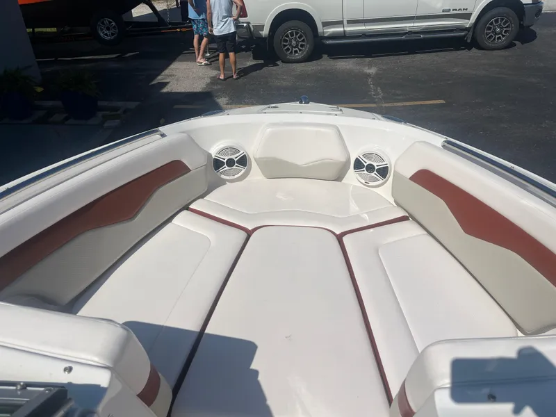 Slide: The Image of 2010 Chaparral 226 boat interior with white and brown seating. - 17