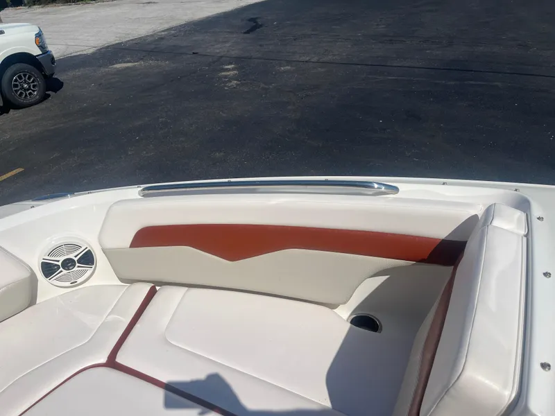 Slide: The Image of 2010 Chaparral 226 boat interior with white and brown seating. - 19