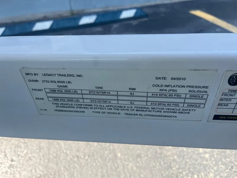 Slide: The Image of Label on 2010 Chaparral 226 trailer by Legacy Trailers, detailing tire and pressure specifications. - 7