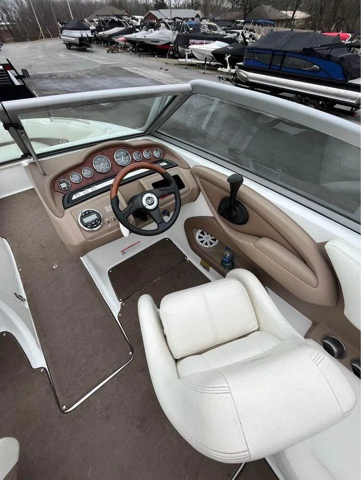 Slide: The Image of Interior of a 2007 Cobalt 232 boat with steering wheel and dashboard controls. - 5