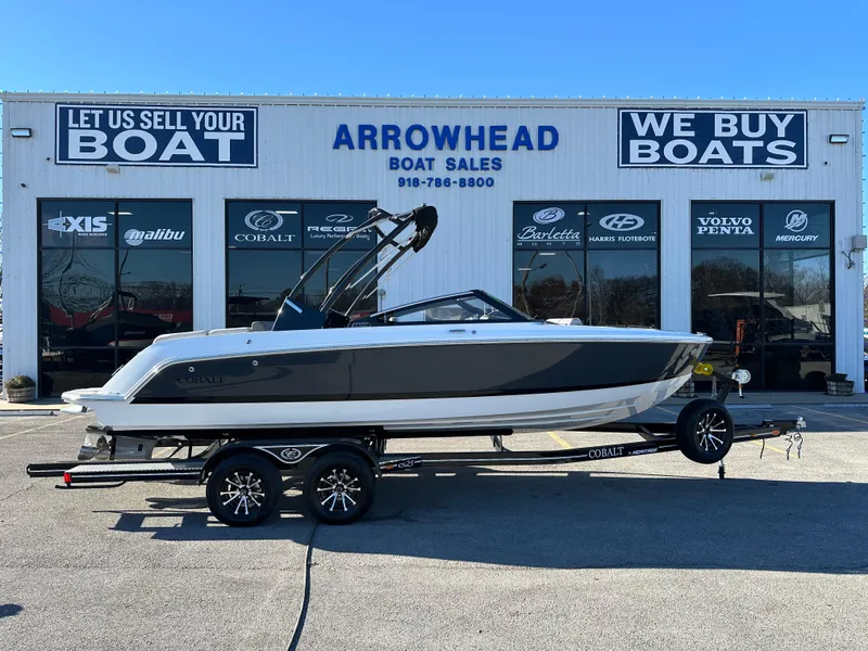 Slide: The Image of 2024 Cobalt CS22 boat on trailer at Arrowhead Boat Sales dealership. - 1