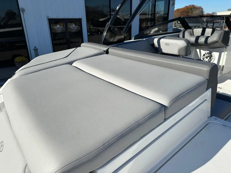 Slide: The Image of 2024 Cobalt CS22 boat with sleek gray seating and modern design. - 10