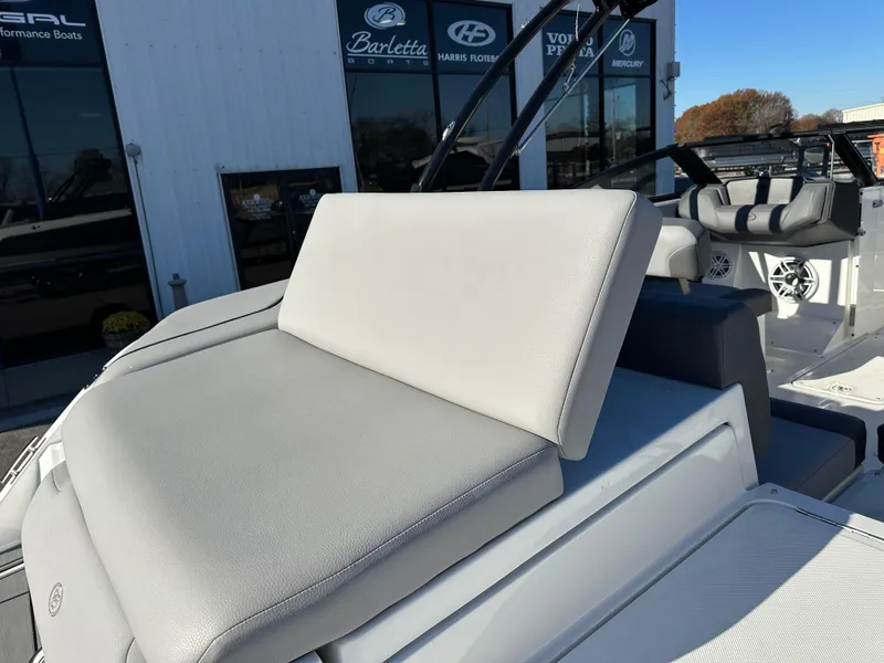 Slide: The Image of 2024 Cobalt CS22 boat interior with gray seating and modern design. - 11
