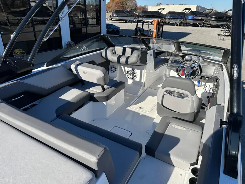 Slide: The Image of 2024 Cobalt CS22 boat interior with modern seating and dashboard design. - 12